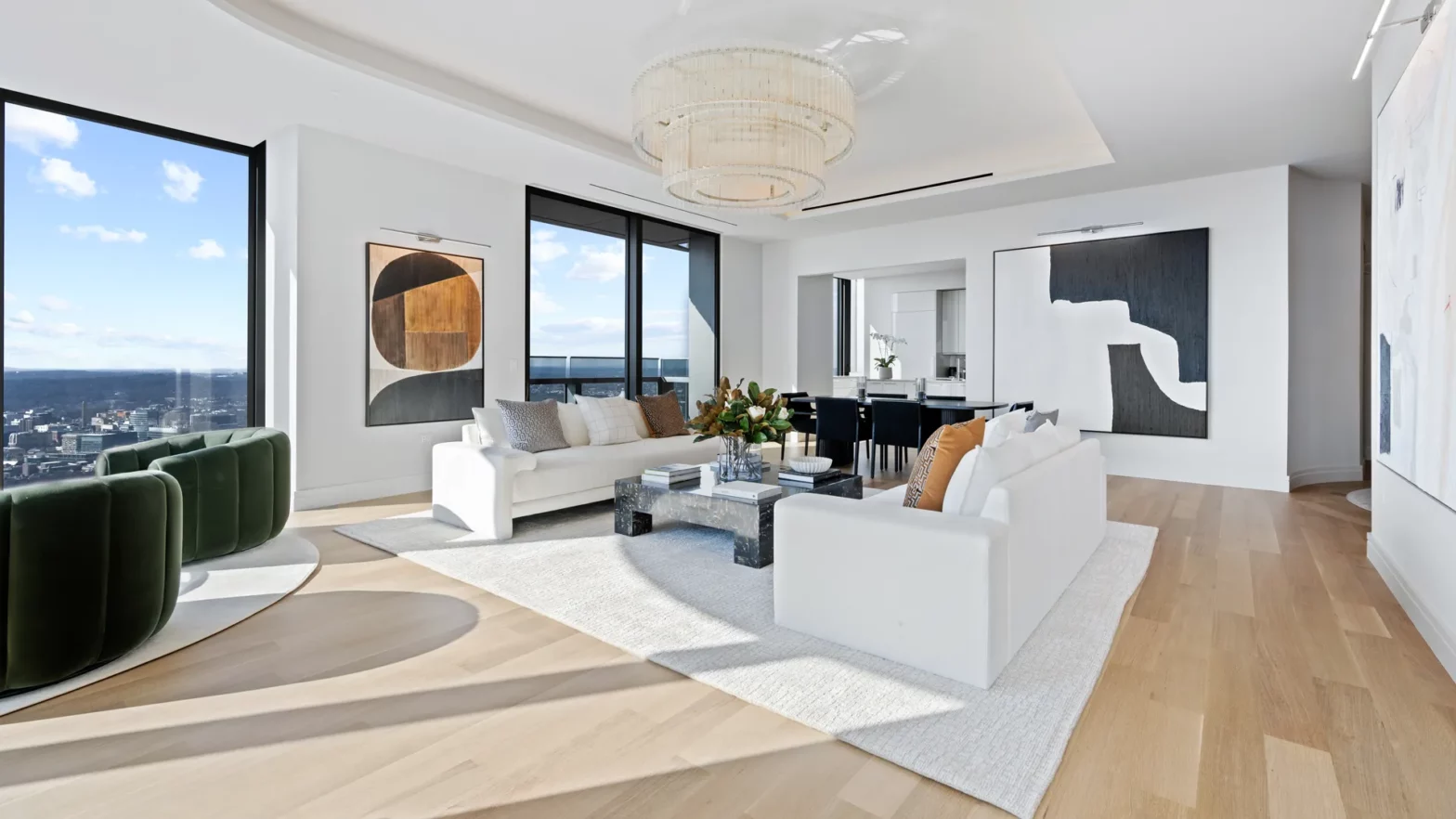 Four Seasons One Dalton signature residences large, light-filled, and open living room and dining area surrounded by windows.